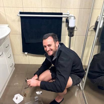Reactive plumber repairing a leaking toilet in a Newcastle bathroom